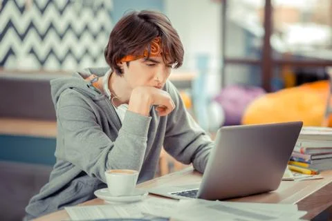 Young IT specialist learning programming language himself Stock Photos