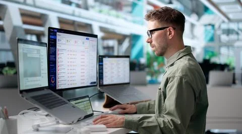 Young IT Support Specialist Solves Customer Laptop Issue Using Helpdesk Softw Stock Photos
