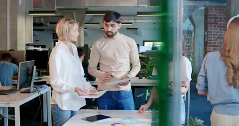 Young IT team talking and planning work. Boss having meeting with employees Stock Footage 180055850