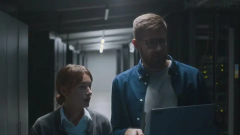 Young IT Technicians Approaching Server Room to Check Mainframe Stock Footage 303554853