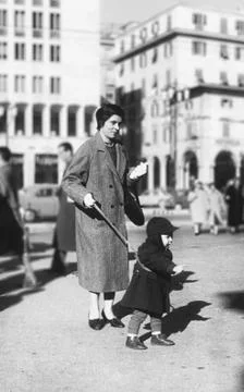 Young italian mother with child in 1950 Stock Photos