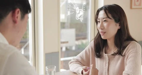 Young Japanese couple enjoying time together at a restaurant Stock Footage 152197319