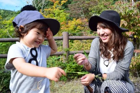 Young japanese mother is playing with her son Stock Photos