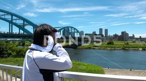 Young JAPANESE RUNNER MAN wiping sweat. Stock Photos
