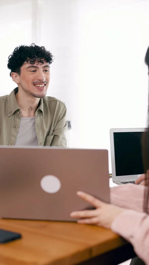 Young job candidate smiling during an interview with a recruiter. Vertical 스톡 동영상 339032681