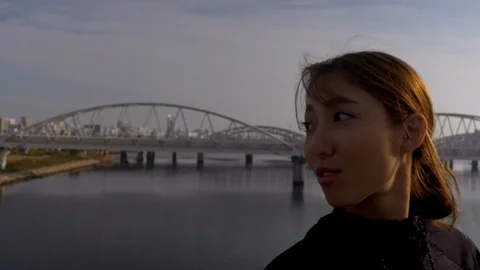 Young jogger turns to look at camera, early morning in the city, HD. Stock Footage 98522782