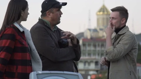 Young journalist making interview in the old center of Tbilisi. 11.10.2017 Video stock 82914695
