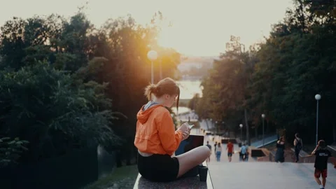 The young journalist writes a new article for the newspaper, makes notes Video stock 163298232