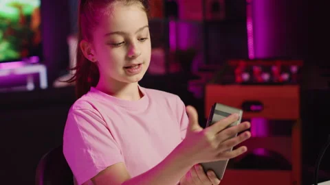 Young kid entertainer doing technology review of Bluetooth portable speaker Stock Footage 255620910