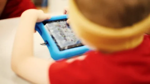 Young Kid Holding iPad Stock Footage 98685523