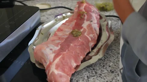 A young kid marinating pork meat Stock Footage 246833482