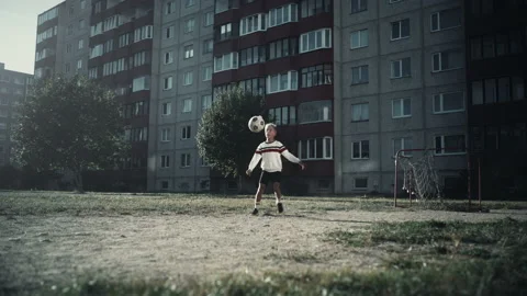 Young Kid Practising Soccer in Suburbs Stock Footage 223053083