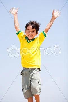 Young kid with raised arms Stock Photos
