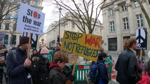 Young kid with stop war not refugees sign Stock Footage 171487195