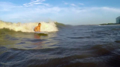 Young kid surfing wave Stock Footage 79212362