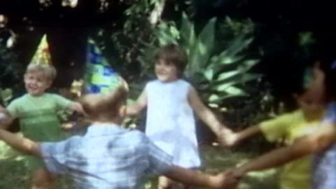 Young kids playing games outside at birthday party Stock Footage 194519968