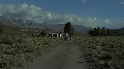 Young Kids Strolling Down Dirt Path in Remote Mountain Valley Stock Footage 341972448