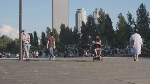 Young Korean children playing with stroller at Han River Stock Footage 114853627
