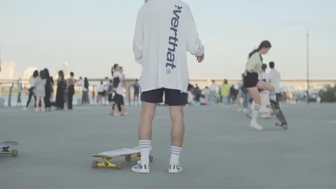 Young Koreans at Han River long boarding Stock Footage 114854104