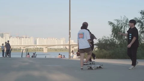 Young Koreans at Han River long boarding Stock Footage 114854182