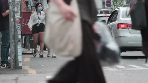 Young Koreans walking in Hongdae during Covid-19 Stock Footage 136034256
