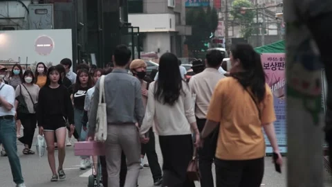 Young Koreans walking in Hongdae during Covid-19 Stock Footage 137363660
