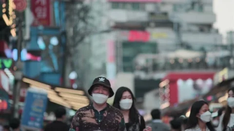 Young Koreans walking in Hongdae during Covid-19 Stock Footage 137363723