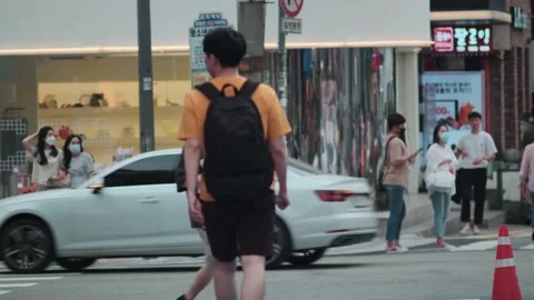 Young Koreans walking in Hongdae during Covid-19 Stock Footage 137654004
