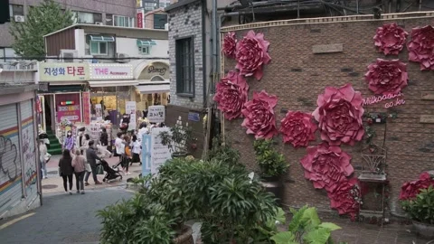 Young Koreans walking in Hongdae during Covid-19 Stock Footage 143855600