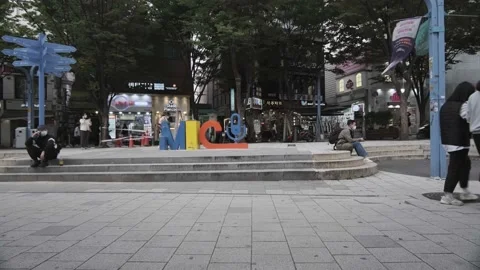 Young Koreans walking in Hongdae during Covid-19 Stock Footage 143856177