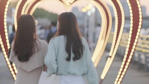 Young Koreans walking through heart tunnel at Han River Stock Footage 115521715