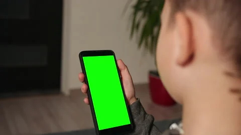 Young lad using video chat on smartphone at home, closeup. Space for design. Stock-Footage 146902661