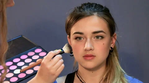 Young lady been applied with make up Video stock 54030659