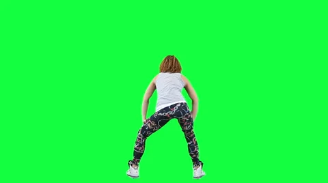 Young lady dancing isolated on green Stock Footage 57638734