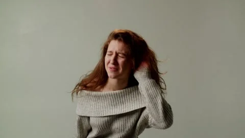 A young lady demonstrates misunderstanding her interlocutor due to poor Stock Footage 252880723