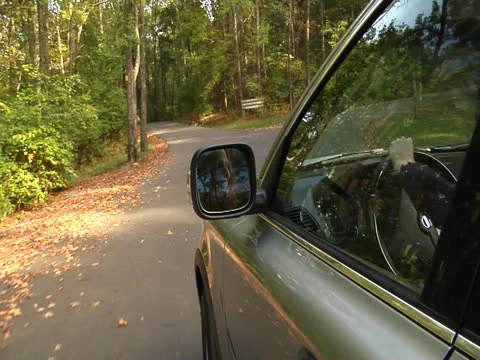 Young lady drives the car efficiently Stock Footage 22860807