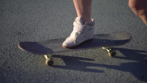 Young lady feet with skateboard Stock Footage