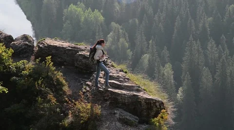 Young lady hiker with backpack making panorama photo on smartphone Stock Footage 66842552
