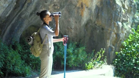 Young lady hiker with the backpack in a mountains Stock Footage 135831783