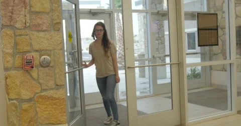 Young Lady Joins Young Man Inside a Building Stock Footage 60992440