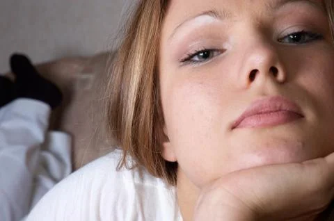 Young lady laying at sofa Foto stock