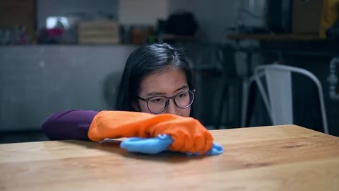 Young lady maid cleaning table, Stock Footage 106794885
