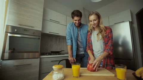 Young lady making breakfast for her man Stock Footage 68730901