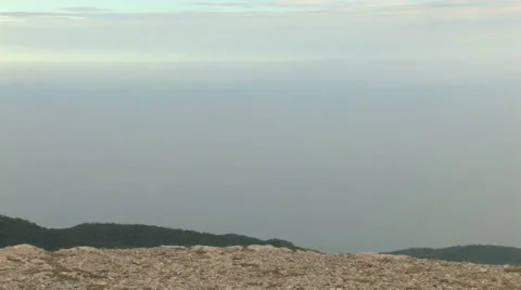  Young lady on a mountain top Stock Footage 959614