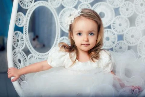 Young lady posing on her first photo shoot on the swing Stock Photos