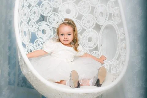 Young lady posing on her first photo shoot with swing. Stock Photos