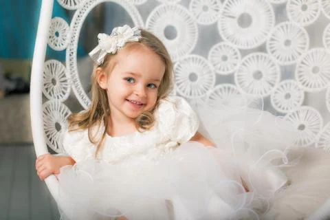 Young lady posing on her first photo shoot, swing. Stock Photos