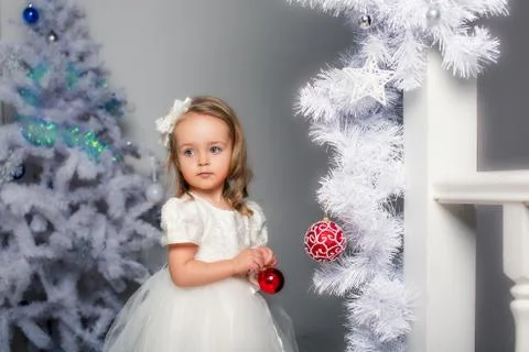 Young lady posing on her first photo shoot. Christmas. Stock Photos