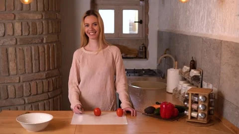Young lady preparing food in a rustic kitchen. Video stock 266456778