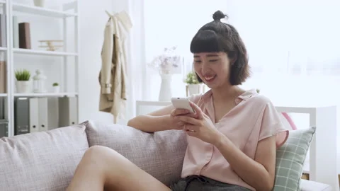Young lady sending text message on cellphone Stock Footage 133471922